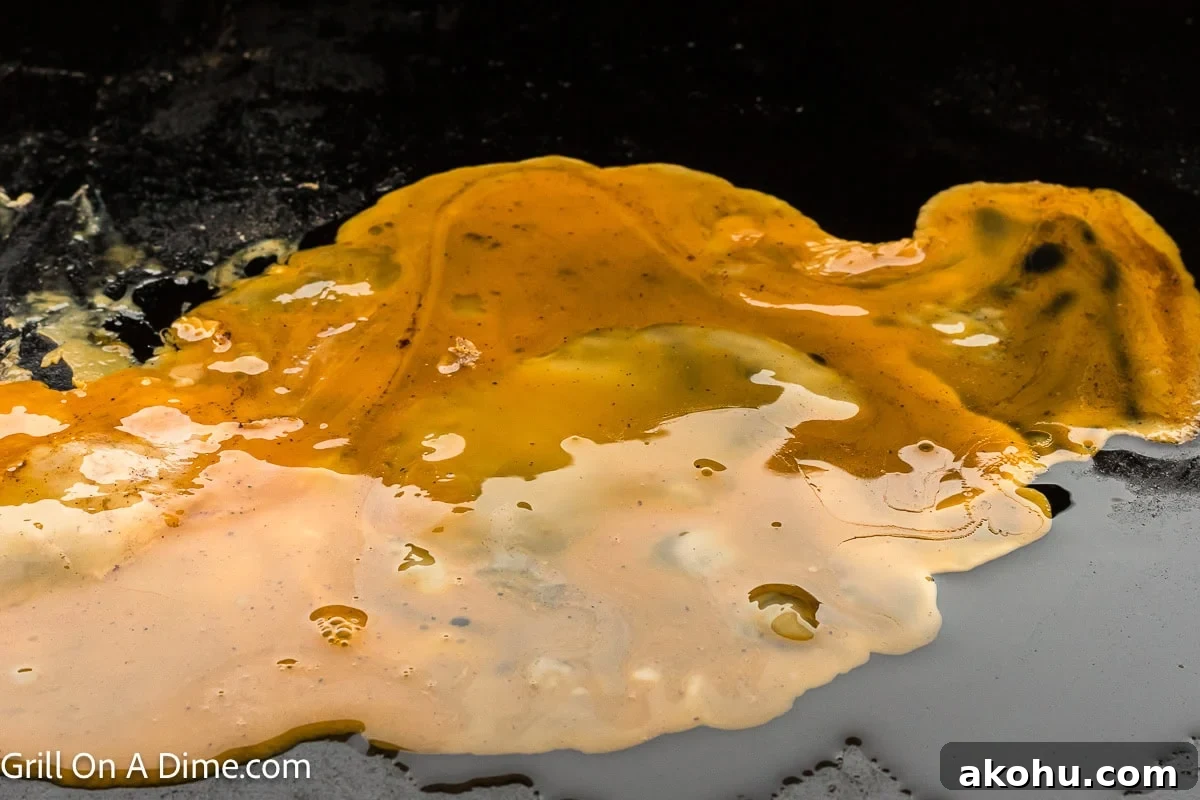 Fluffy Scrambled Egg Sandwich Recipe for Quick Breakfast 5 Spreading scrambled eggs on the griddle