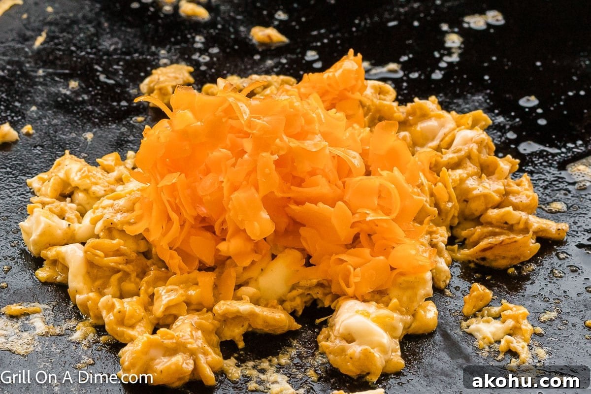 Fluffy Scrambled Egg Sandwich Recipe for Quick Breakfast 6 Scrambled eggs topped with shredded cheese