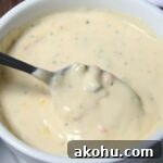 Broccoli Cheddar Soup in bowl with spoon