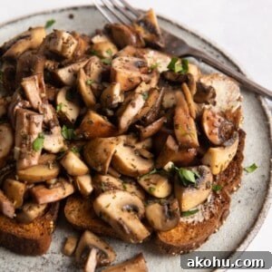 garlic mushrooms on toast with a white plate
