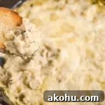 Cheesy Chicken Artichoke Skillet Dip on bread