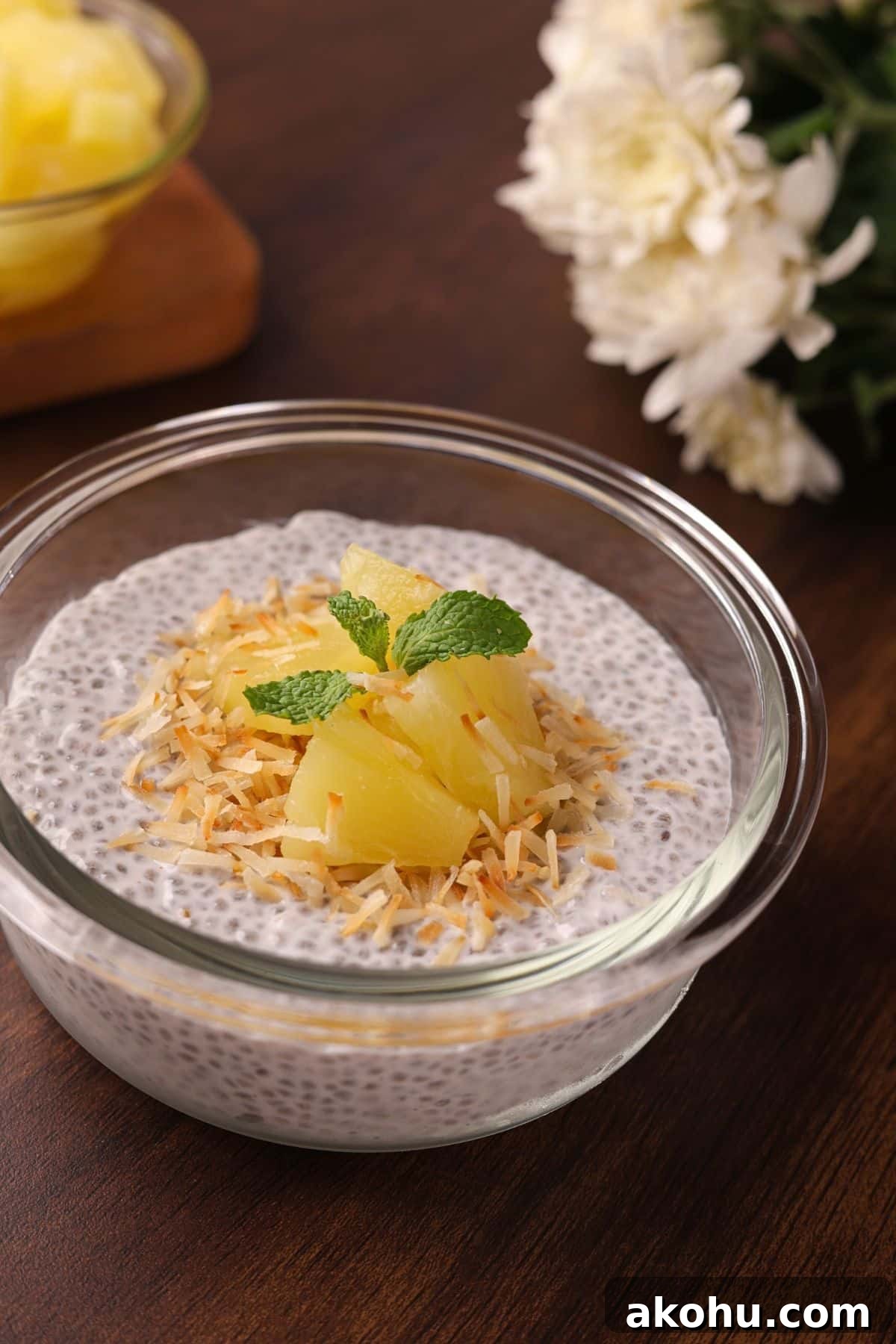 Creamy Coconut Chia Pudding Recipe for a Satisfying Breakfast 6 Final coconut chia pudding served in a bowl, topped with pineapple chunks, toasted coconut, and ready to enjoy.