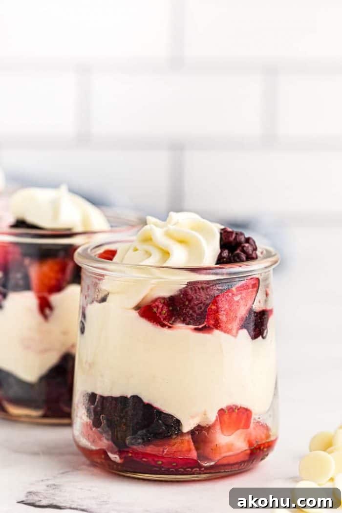 side view of small dish containing keto mousse layered with berries