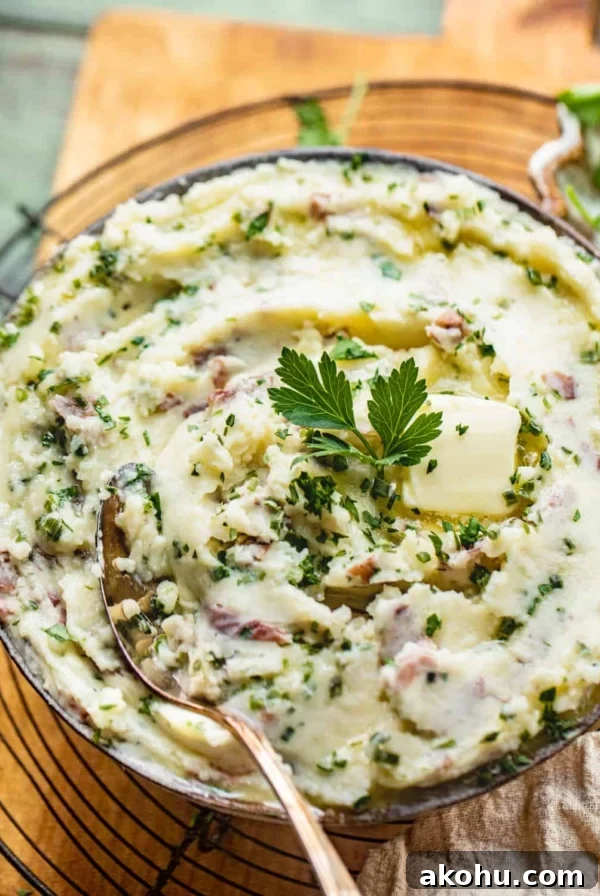 mashed potatoes in a bowl on a serving tray.
