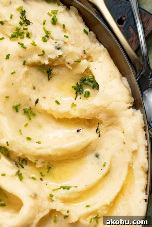 Butter melted over the top of cheesy mashed potatoes.