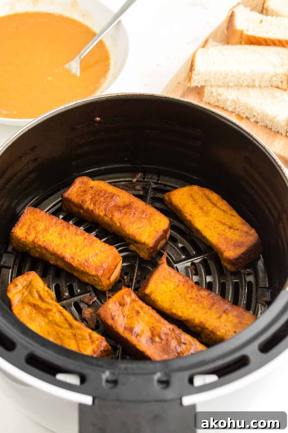 Pumpkin French toast sticks in an air fryer.