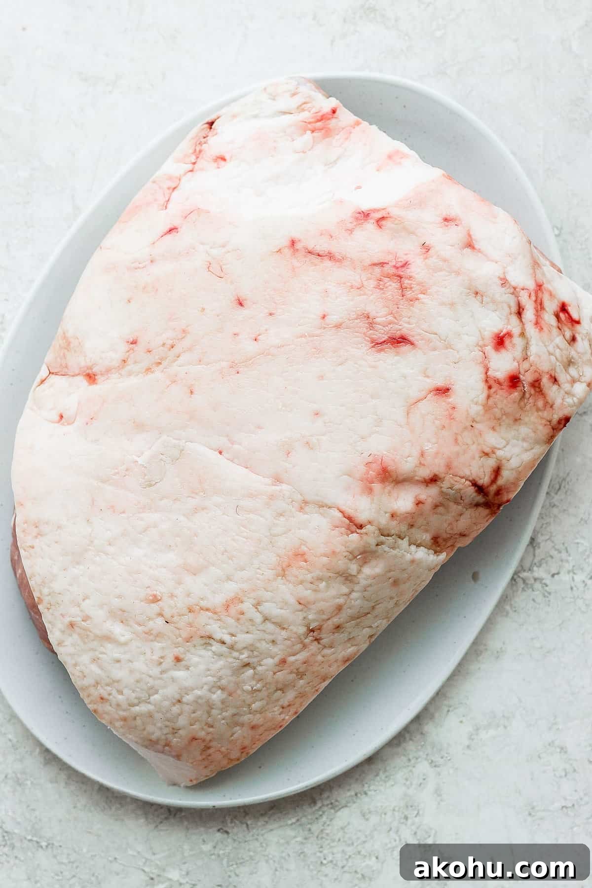 Raw ham on a plate.