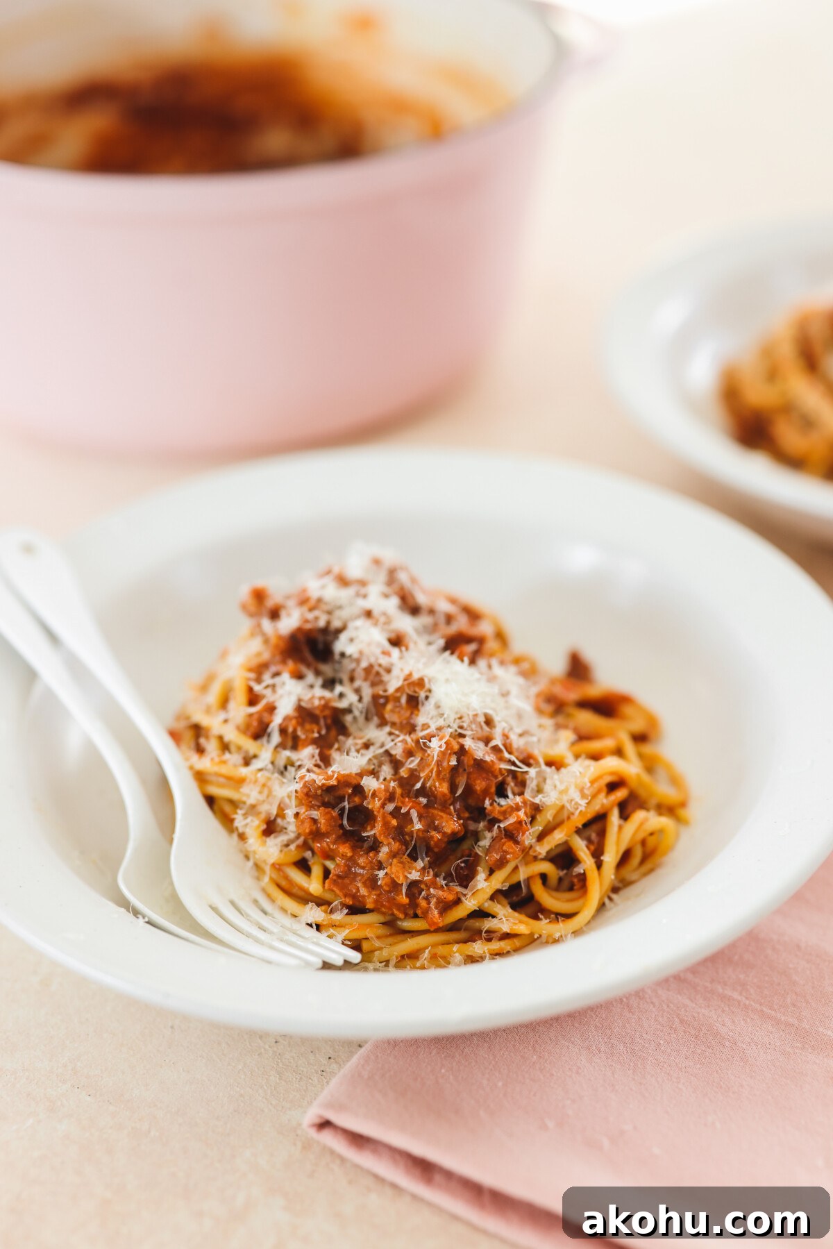 a plate of vegan bolognese served on top of pasta 