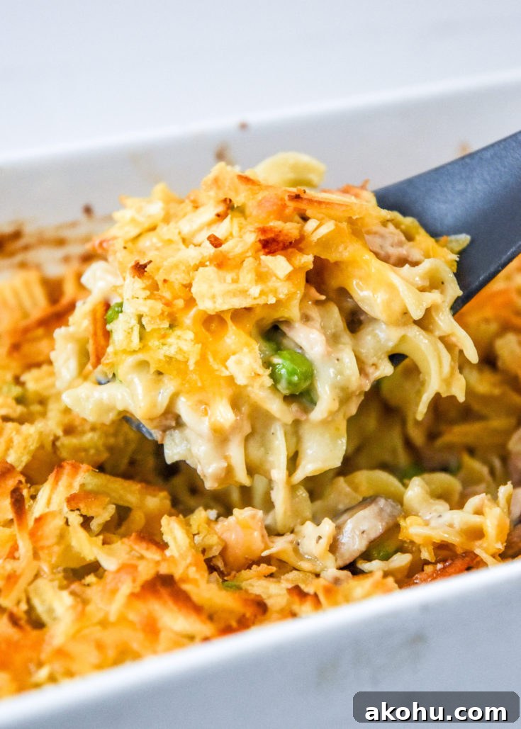 scoop of freezer friendly tuna noodle casserole fresh from the oven.