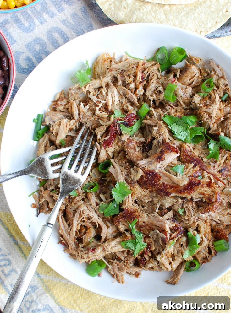 Easy Slow Cooker Pork Carnitas In a White Bowl 