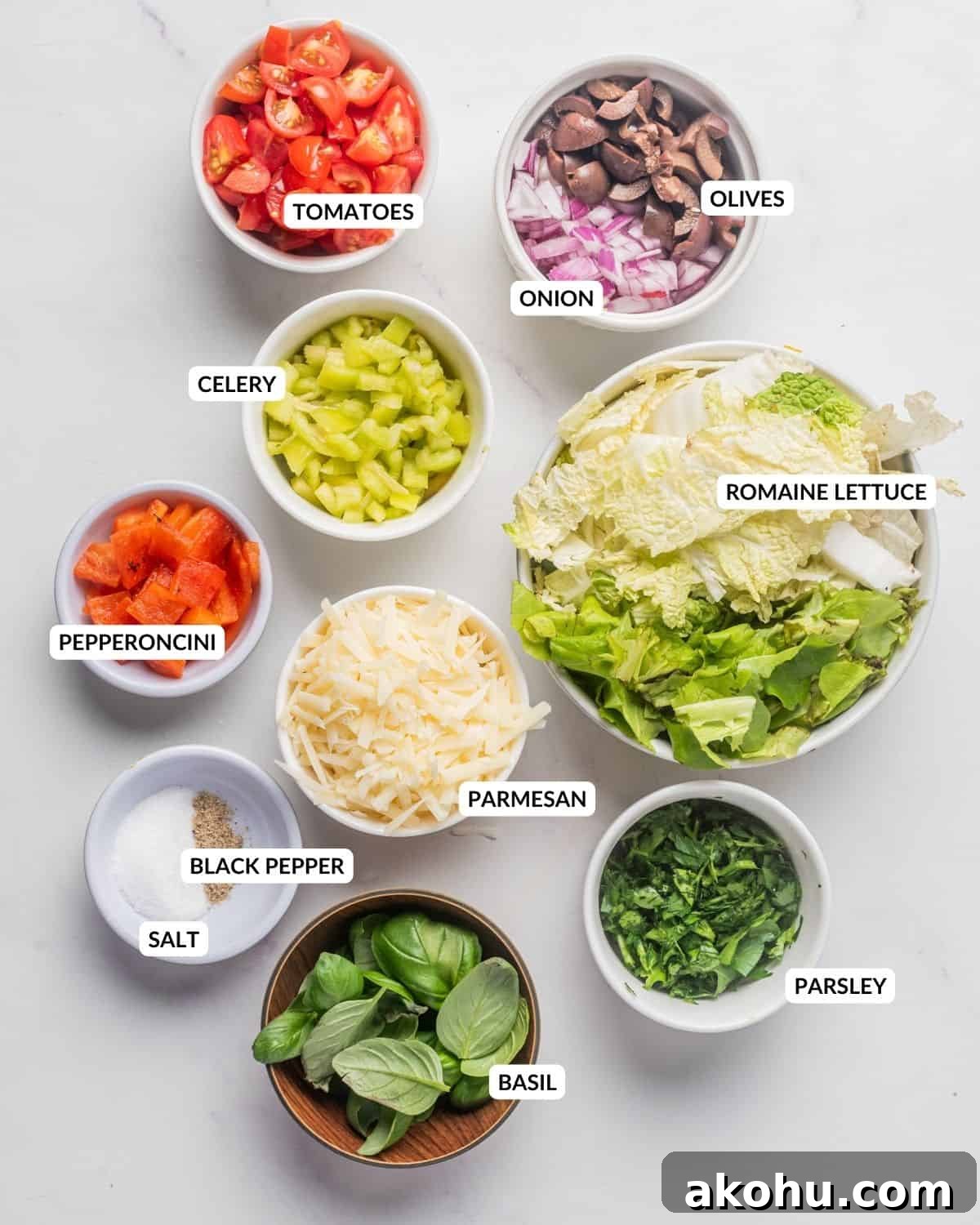 Classic Italian Chopped Salad Recipe with Zesty Dressing 5 An image of all the labeled ingredients of Italian chopped salad, in separate bowls.