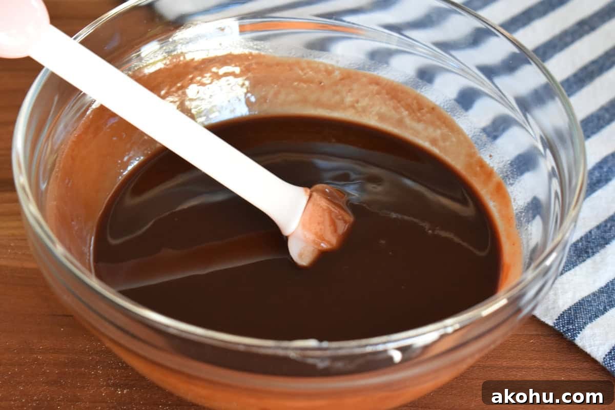 Moist Chocolate Pumpkin Cake Recipe – Simple Fall Dessert 5 Melted butter and chips in a glass bowl.