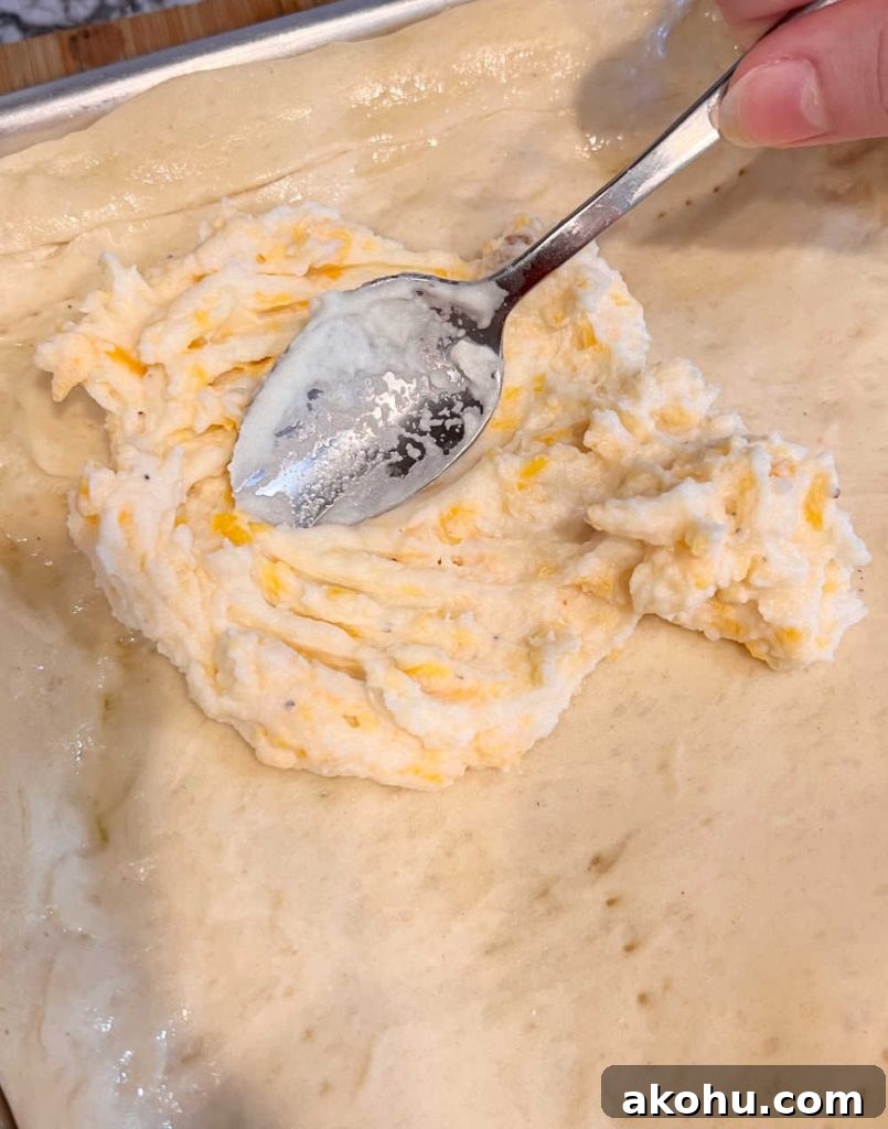 Pierogi Pizza (Pagach) Recipe: Polish Dumpling-Style Pizza 5 spread cheese mash potatoes on pizza crust