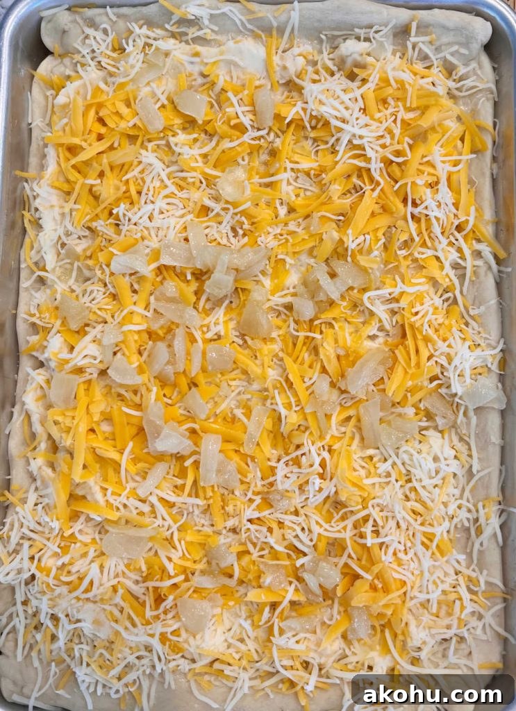 Pierogi Pizza (Pagach) Recipe: Polish Dumpling-Style Pizza 6 unbaked pierogi pizza with mashed potatoes, cheese and onions on baking sheet