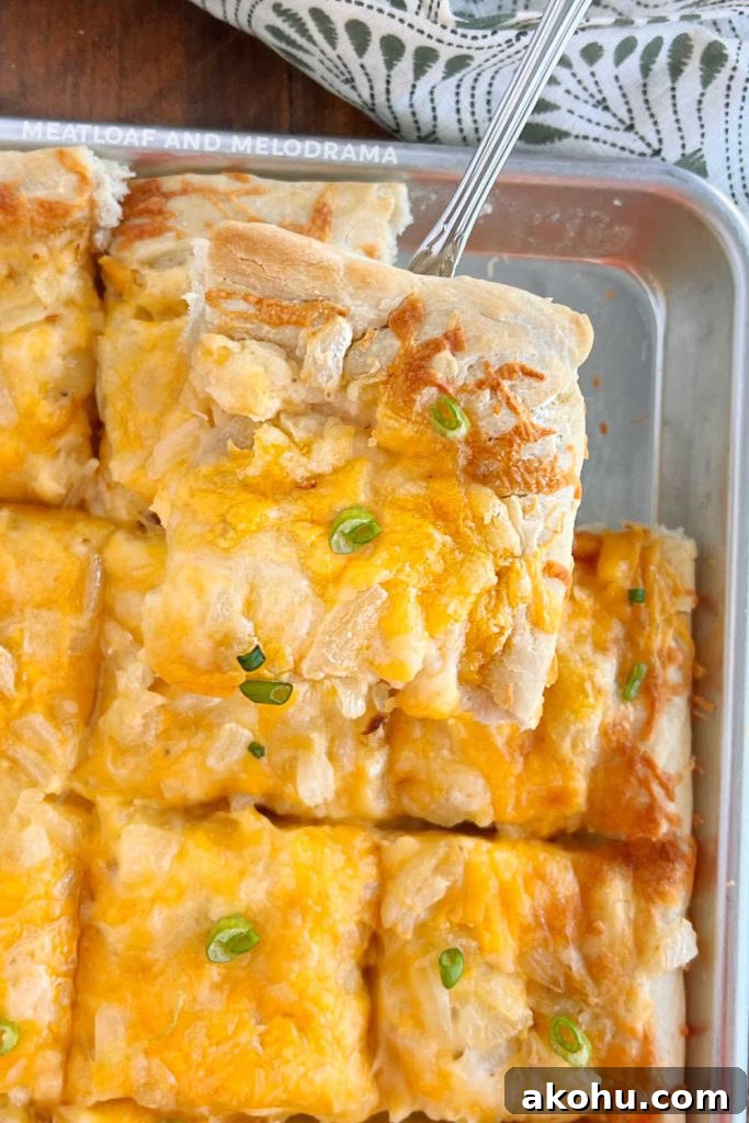 Pierogi Pizza (Pagach) Recipe: Polish Dumpling-Style Pizza 7 slice of pierogi pizza on spatula