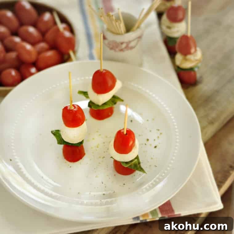 Mini Caprese Skewers: Fresh Tomato, Mozzarella & Basil Bites 2 Caprese Salad Appetizers @loavesanddishes.net