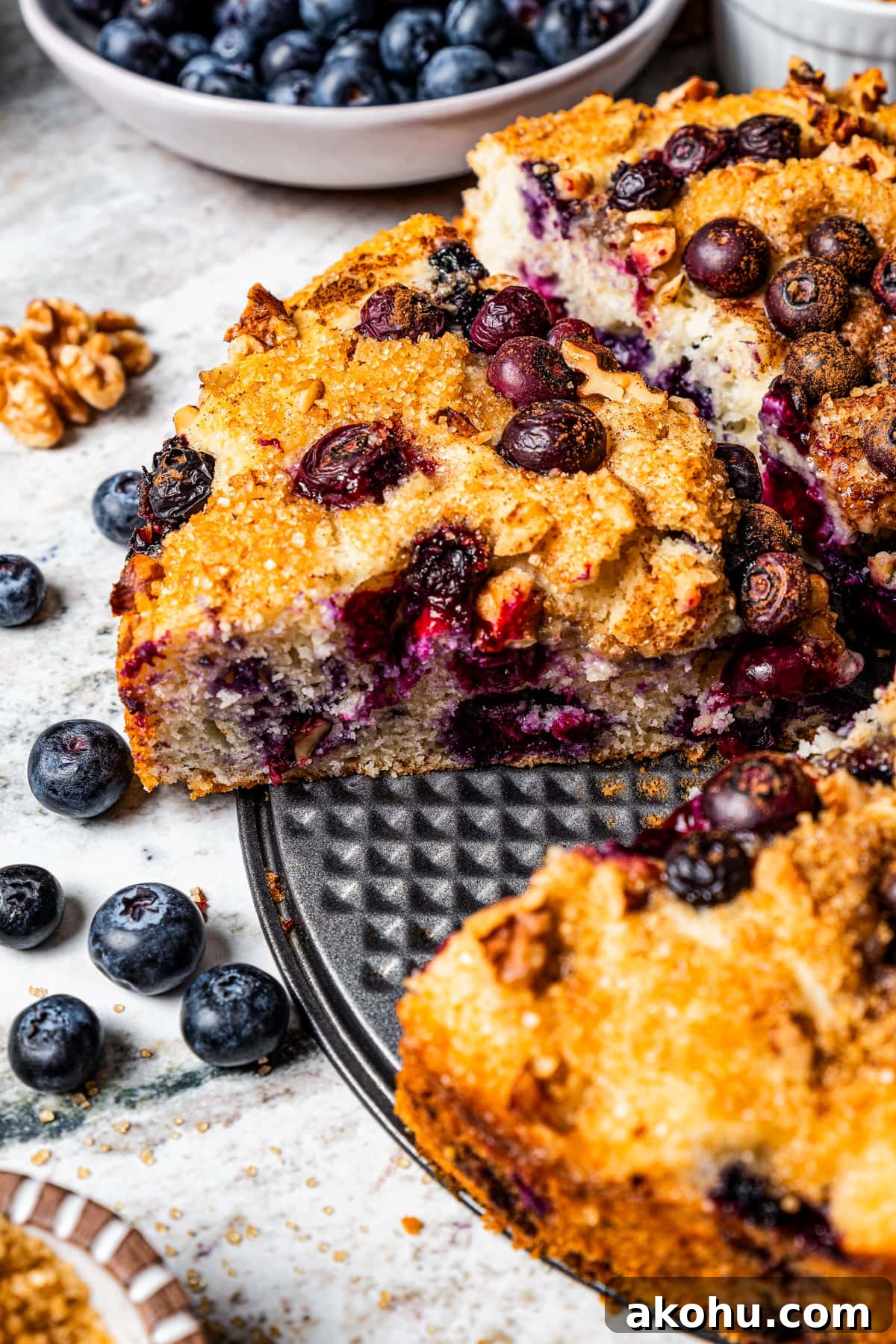 Baked blueberry cake cut into slices.
