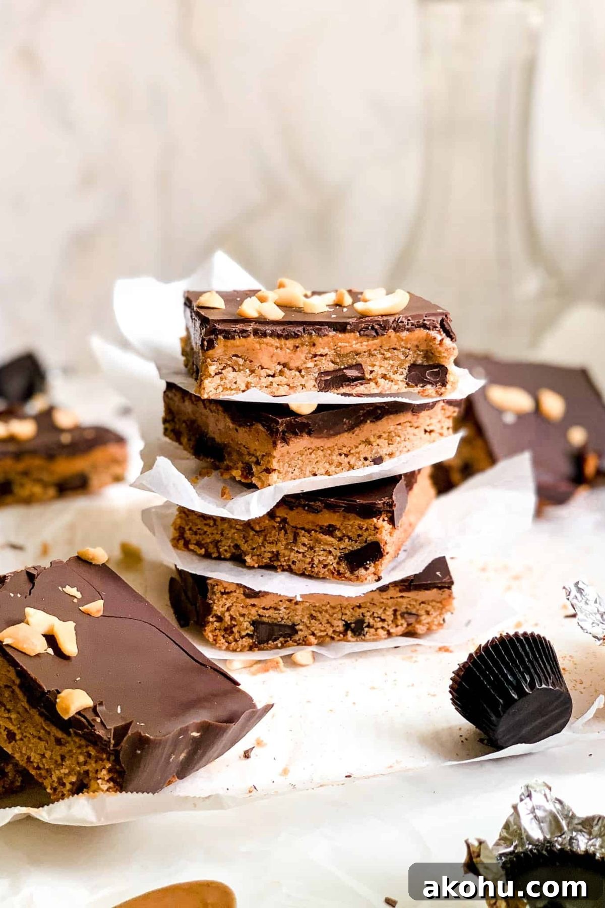 Stack of Homemade Dessert Bars with Peanut Butter and Melted Dark Chocolate