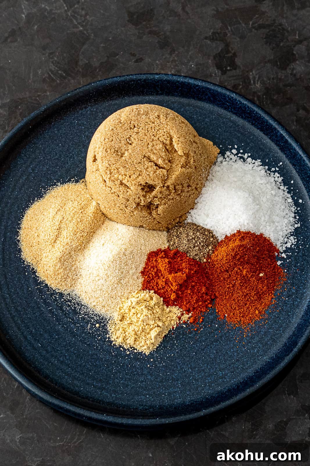 Closeup of spices in pork rib rub with brown sugar mustard powder garlic onion and more