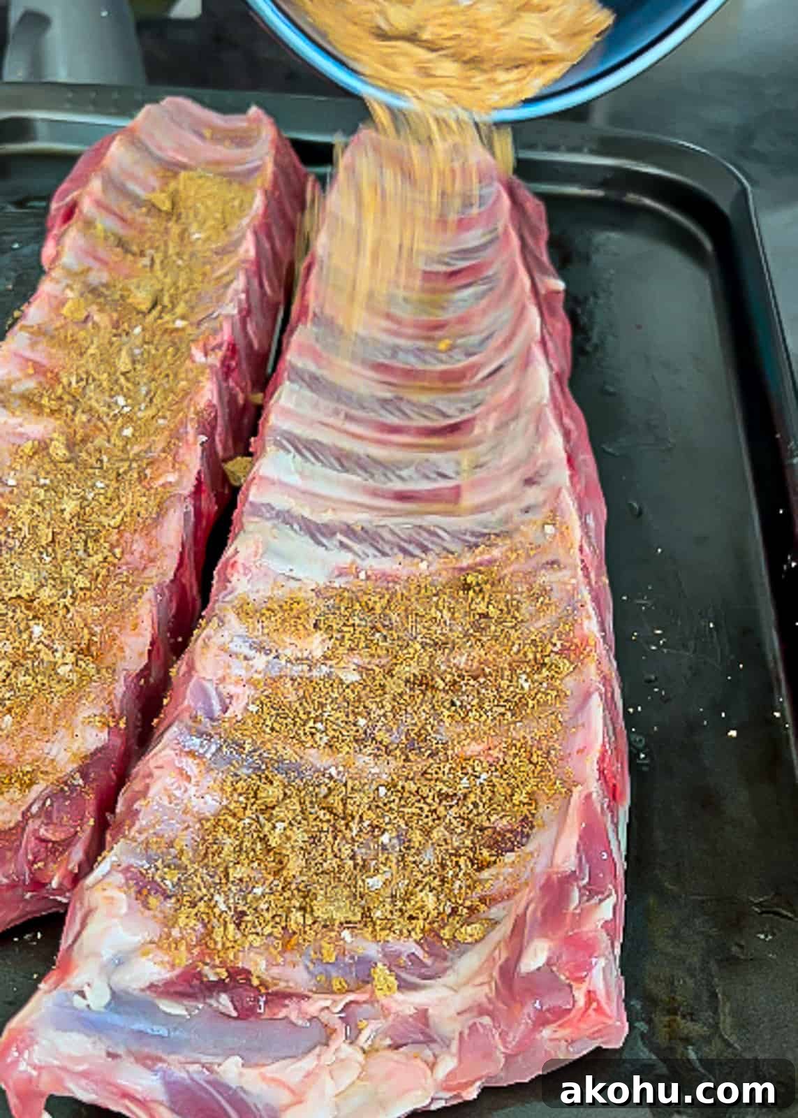 Adding pork rib rub to pork meat