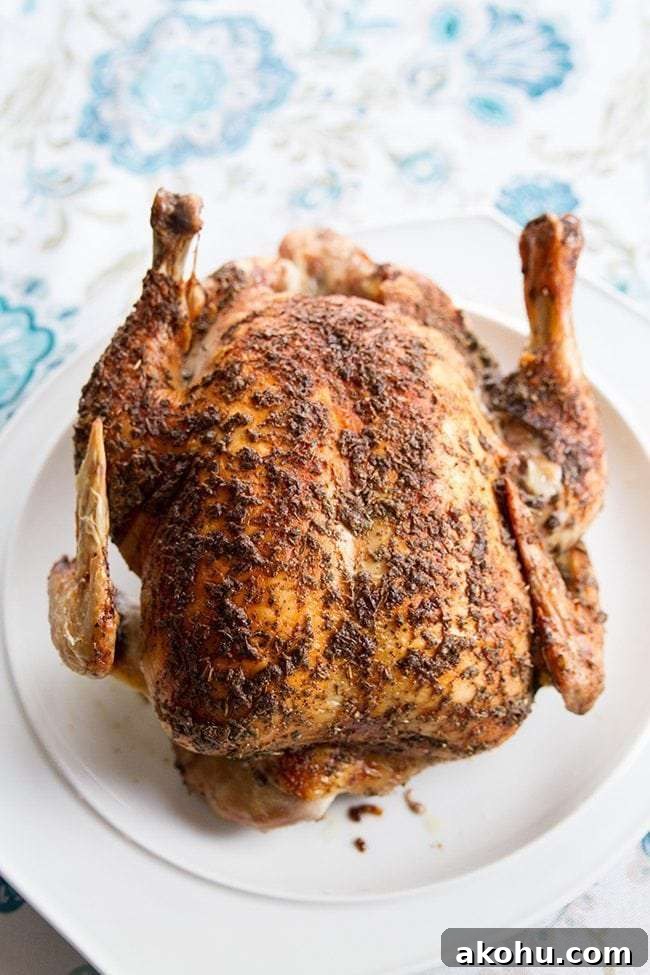 Herb and Butter Roasted Low-Carb Chicken Recipe 3 Herb & Butter Roasted Low Carb Chicken on a White Platter