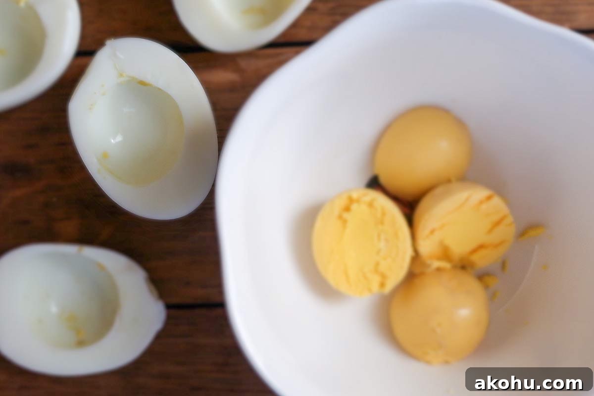 Deviled Eggs: Complete Guide with Top Recipes and Tips 5 cooked eggs halve and the yolks separated