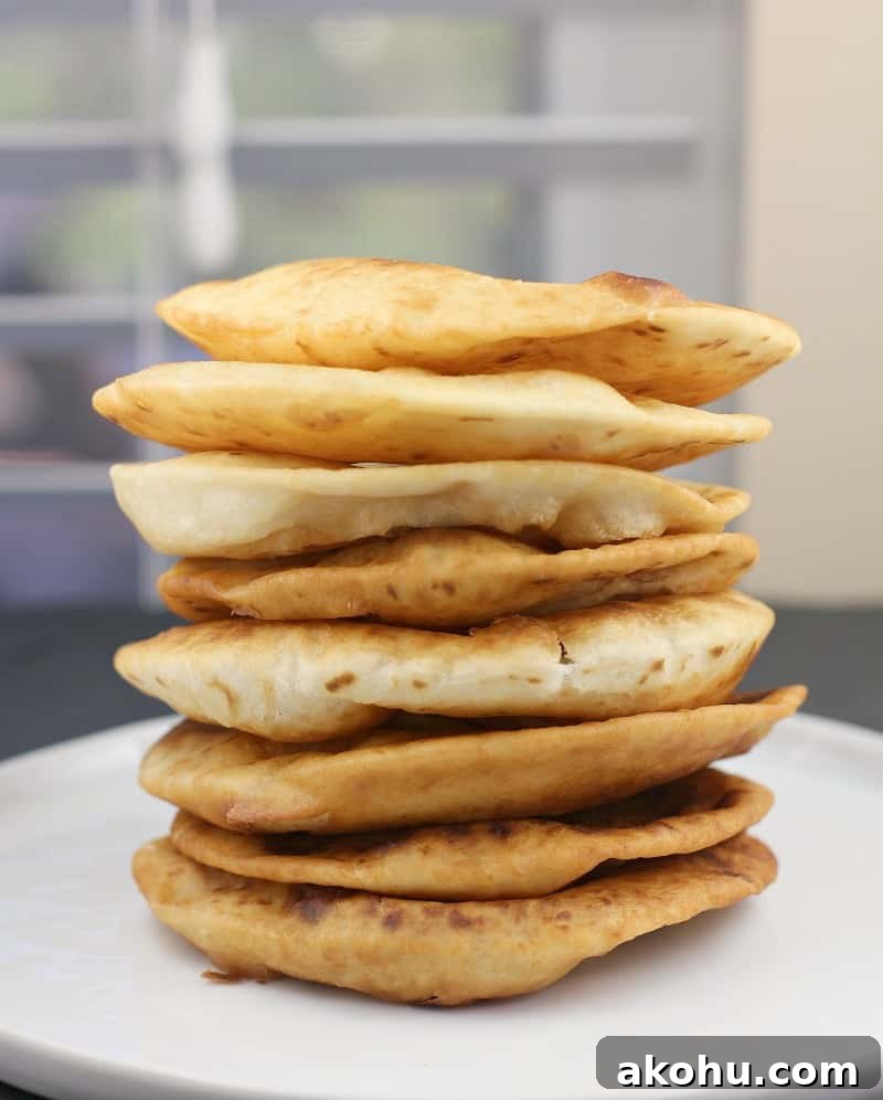 fried tortillas stack on a white plate