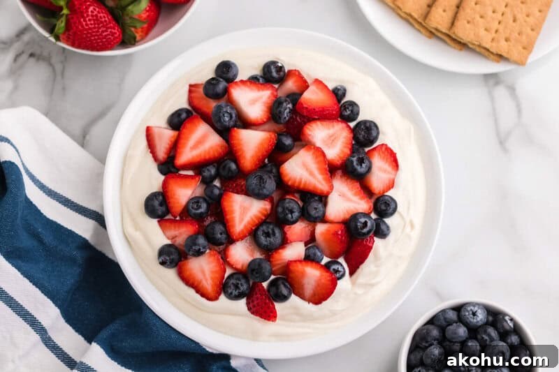 Patriotic Layered Cheesecake Dip for Fourth of July Parties 4 top-down view of a bowl of the Patriotic Cheesecake Dip.