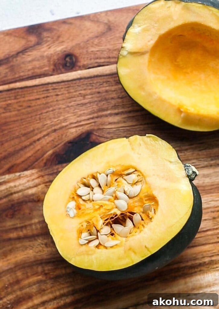 Crispy Air-Fryer Acorn Squash Recipe for Fall Sides 7 An acorn squash cut in half.