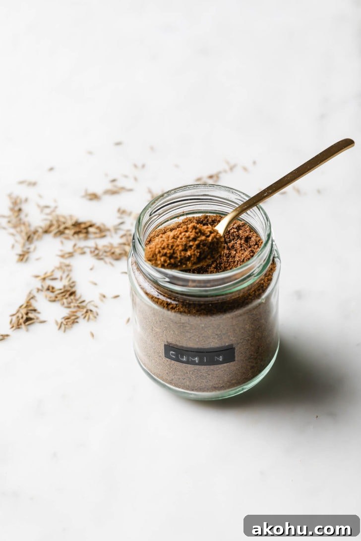 Showing texture of cumin powder in a spice jar.