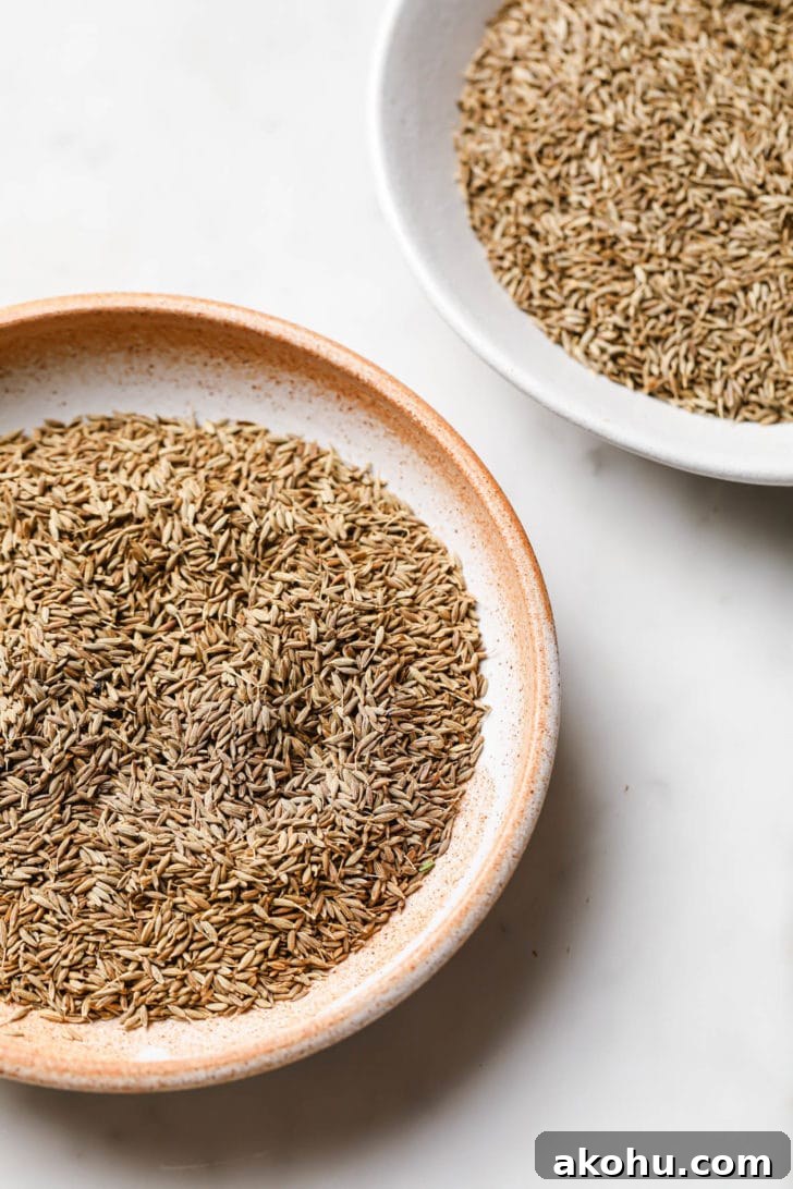 Cumin seeds in a round, glazed plate.