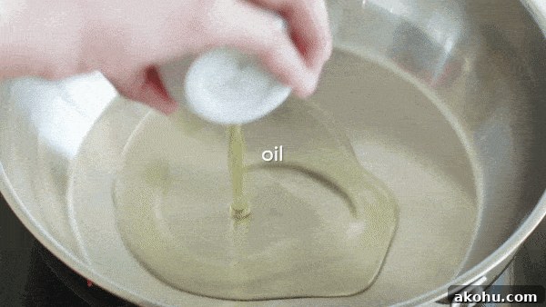 Adding cumin seeds into hot oil