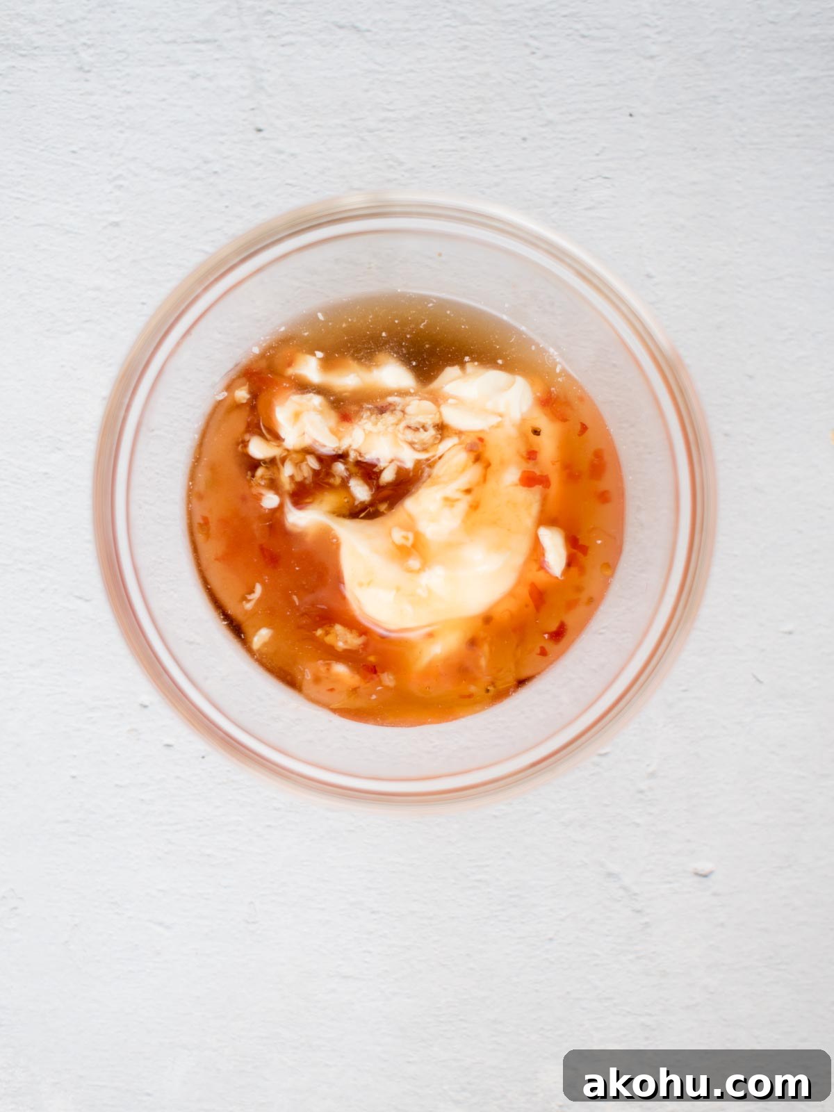 bang bang sauce ingredients in a mixing bowl