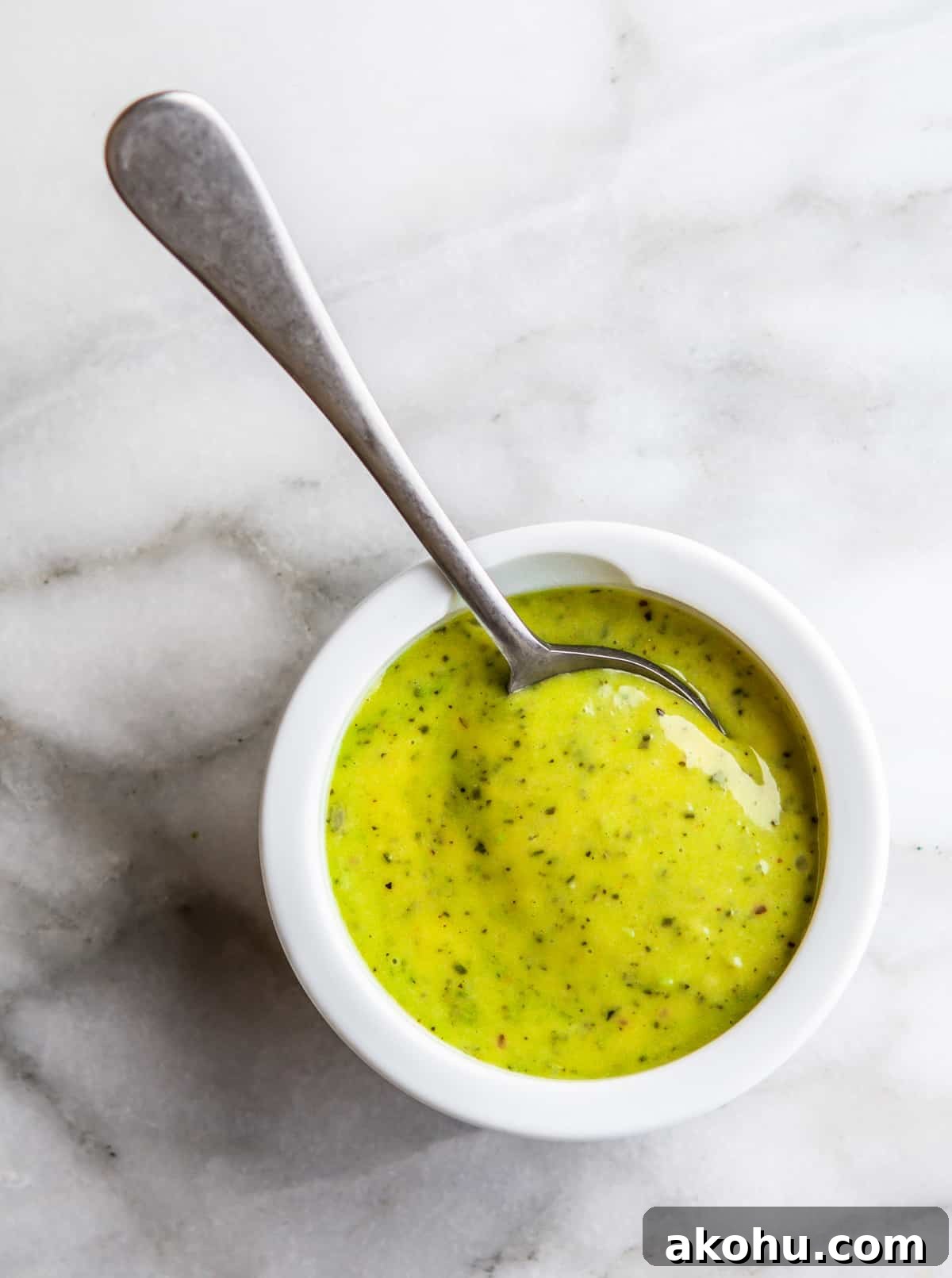 Creamy Pesto Aioli Recipe: Flavorful Sauce for Sandwiches & Dips 2 Pesto Aioli served in a white bowl with a spoon