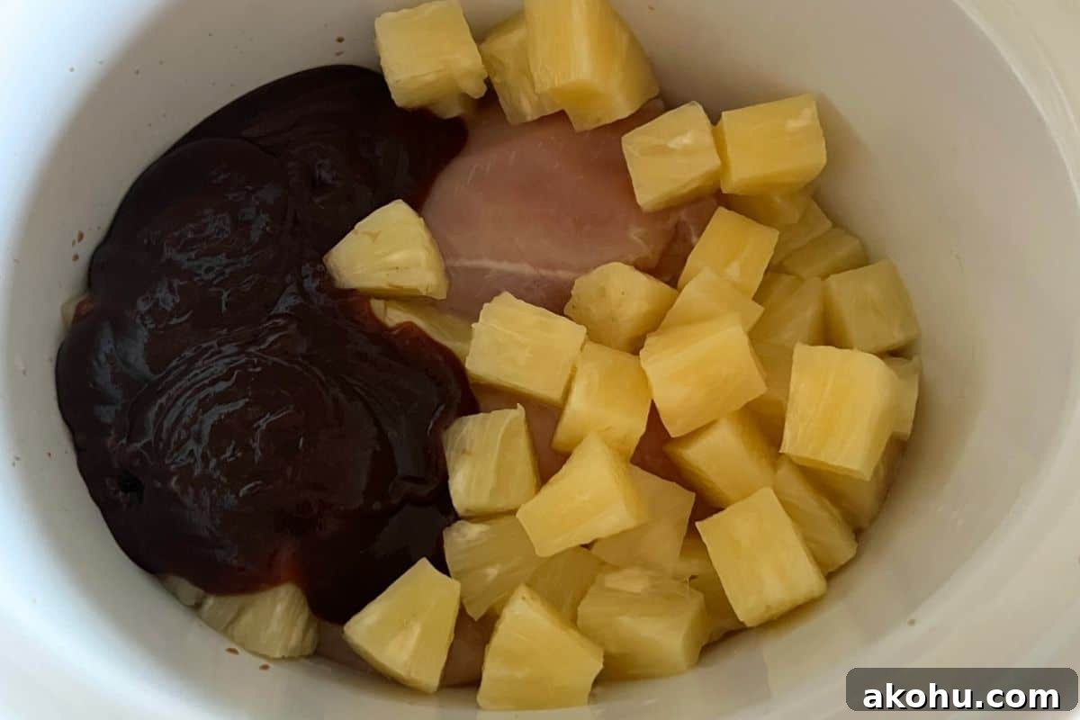 Ingredients combined together in a slow cooker. 