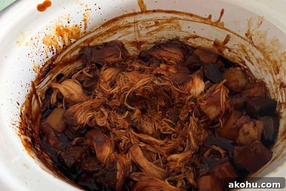 Shredded bbq chicken with pineapple in a slow cooker. 