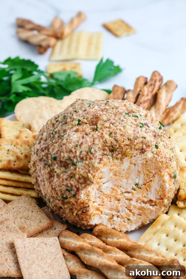 close up of a cheese ball on a platter