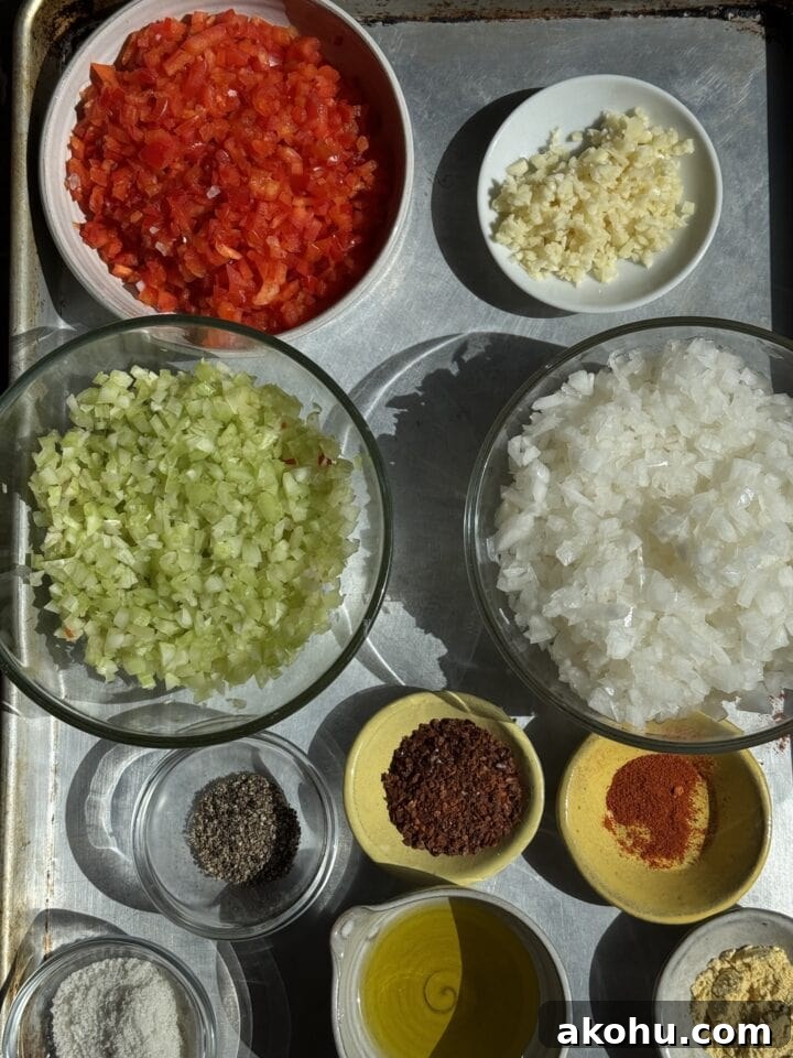Savory Sloppy Joe Sliders with Tangy BBQ Sauce 3 ingredients for sloppy joe sliders in small bowls on a baking sheet