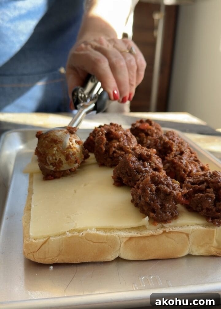 Savory Sloppy Joe Sliders with Tangy BBQ Sauce 6 teri scooping sloppy joe mix onto slider buns