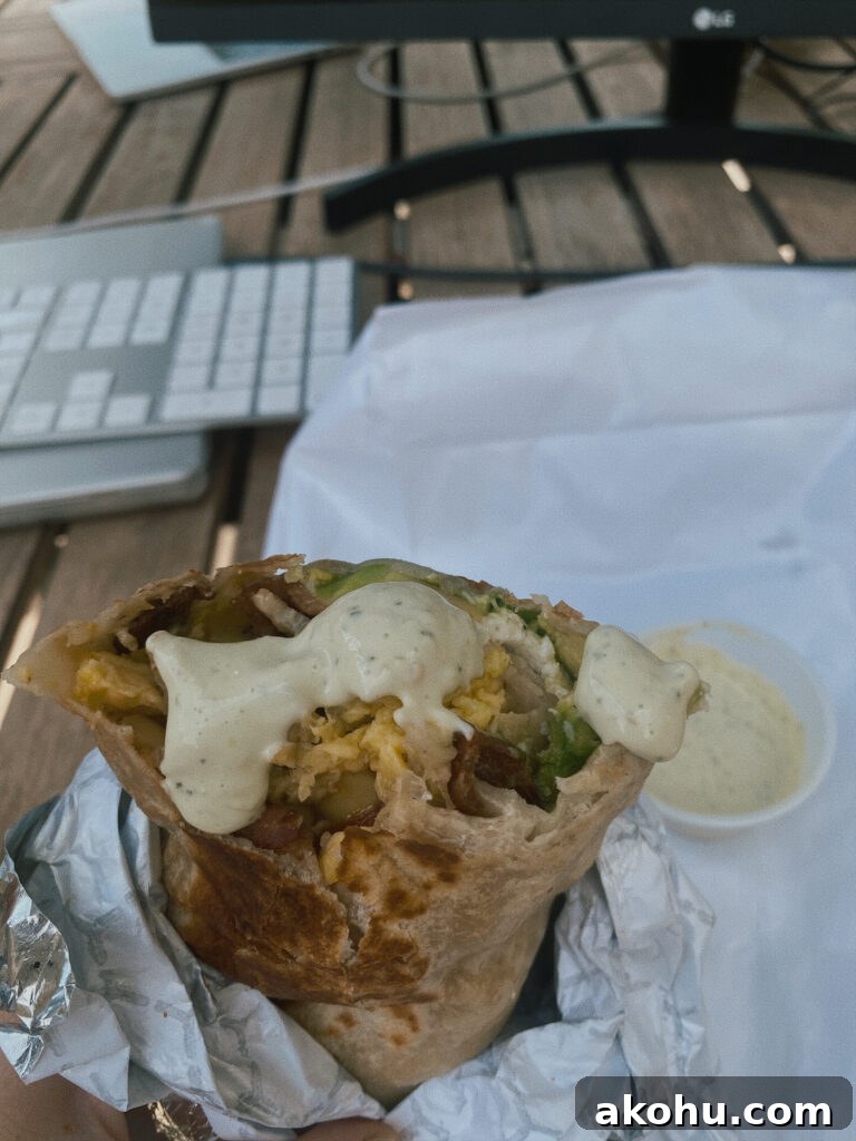 Skier’s Breakfast Burrito at Beaumont Bakery — What to Try Today 4 Breakfast burrito with sauce