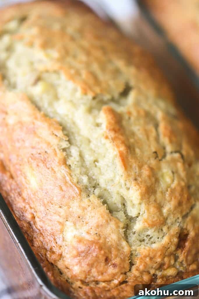 Moist Banana Bread Recipe From Scratch 3 Homemade banana bread in a glass loaf pan.