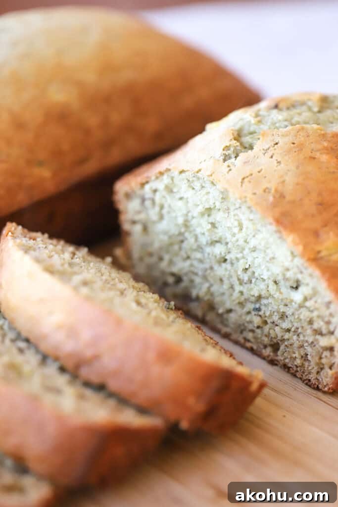 Moist Banana Bread Recipe From Scratch 4 sliced banana bread on a wood cutting board