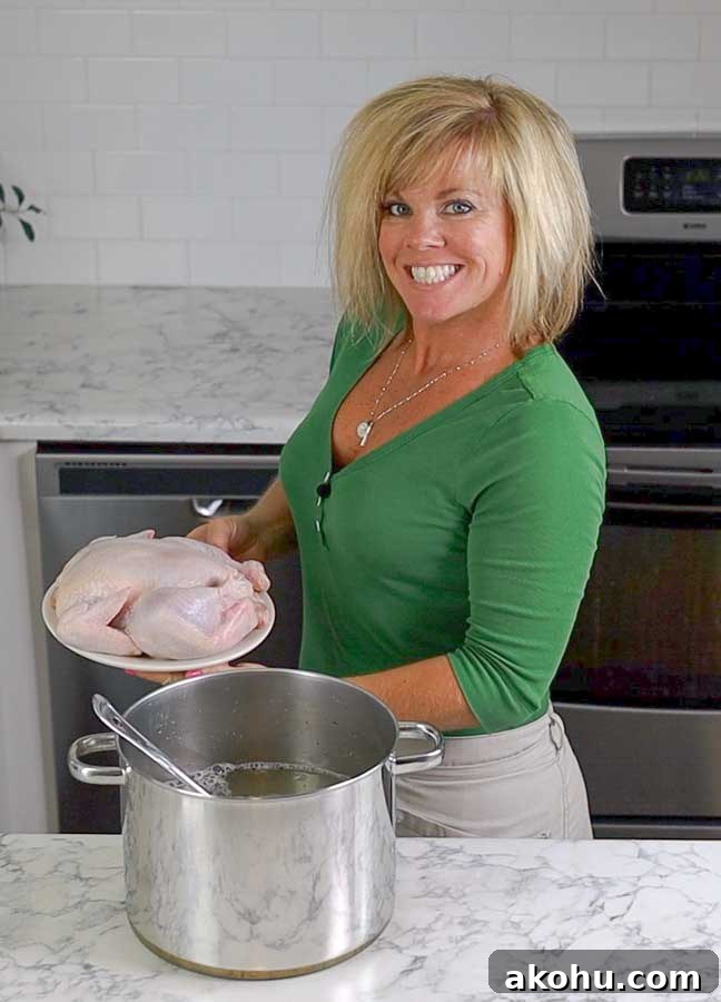 Turkey and Chicken Brine Recipe for Juicy, Flavorful Poultry 3 Jennifer holding a chicken ready to go into the brine