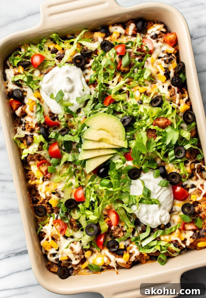 Cheesy Taco Casserole with Beef and Crispy Tortilla Topping 8 a baking dish with taco casserole