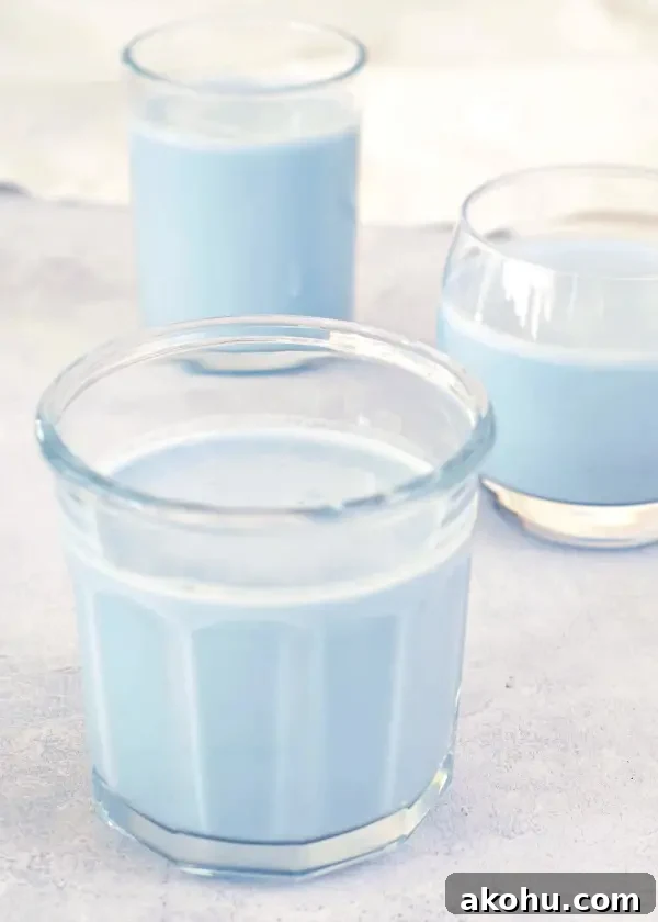 pale blue vanilla mint cashew milk in three various clear glasses