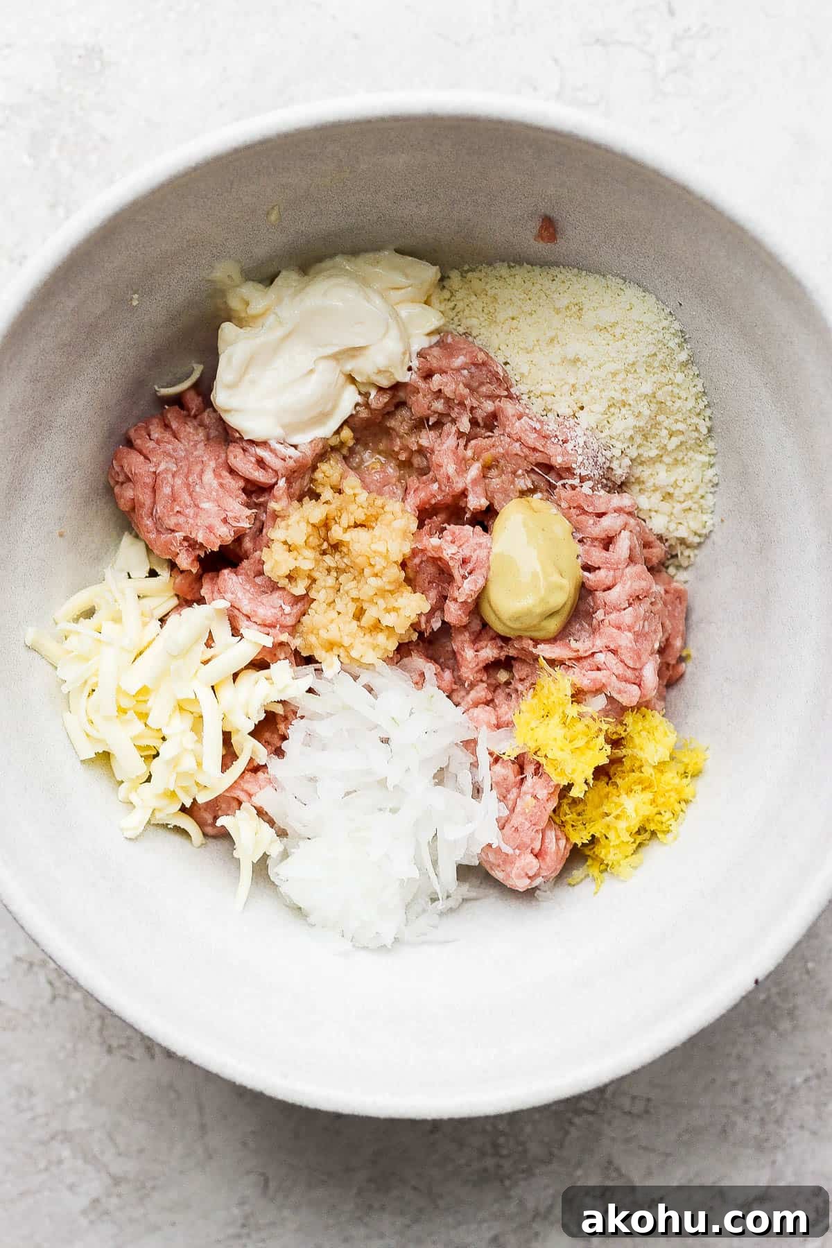 Ingredients for turkey avocado burgers in a bowl.