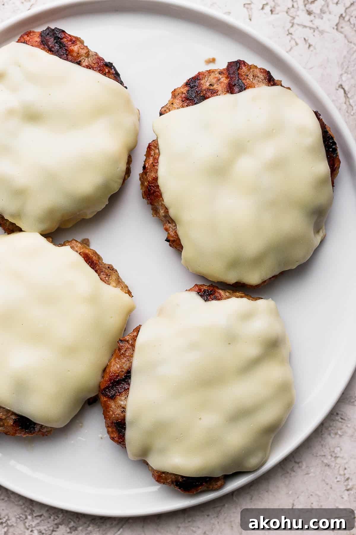 Juicy grilled turkey burgers with cheese.