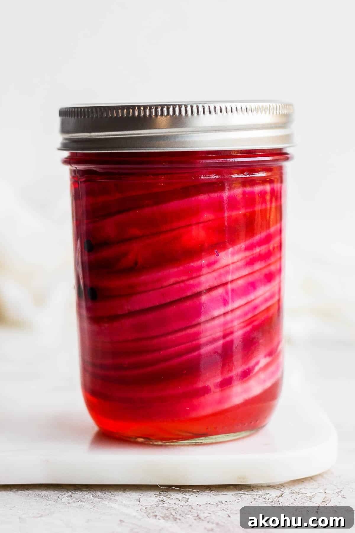 Mason jar with quick pickled onions.