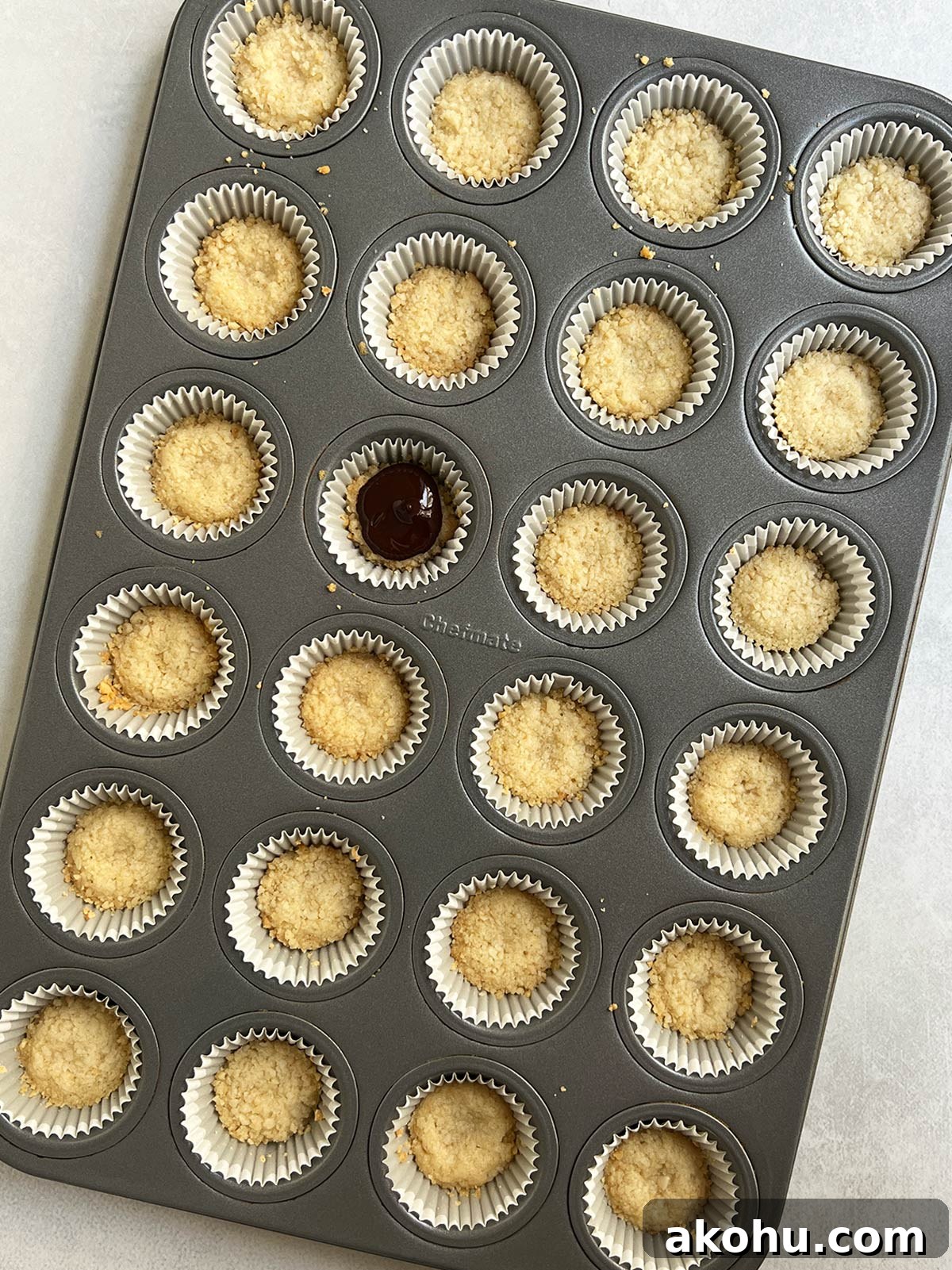 Baked macadamia crusts in mini cupcake pan.