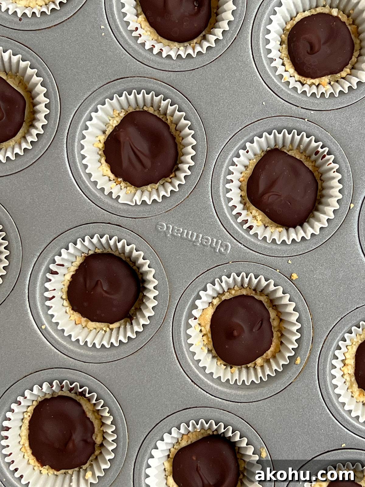 Close up of chocolate hardened on the mini key lime pies.